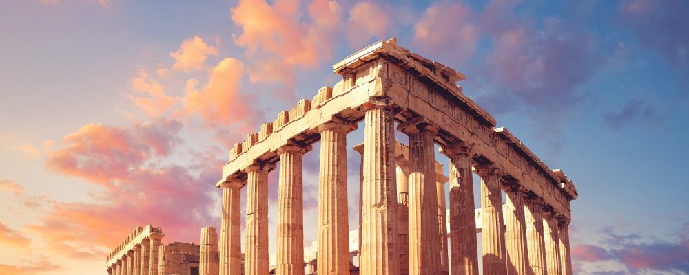 Parthenon temple on a sunset with pink and purple clouds. Acropolis in Athens, Greece